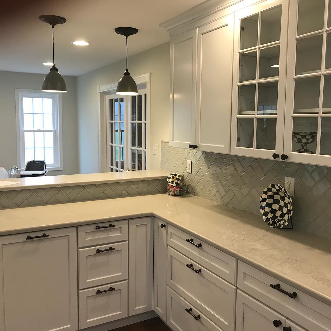 Full Kitchen Remodel with fresh flooring, backsplash, cabinets and Noble Grey surfaces